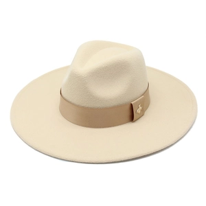 Detail of wool fedora hat with beige ribbon and golden honeybee metal emblem