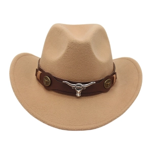 Detail of western cowboy hat with brown leather band and silver bull head ornament