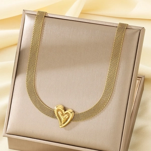 Gold mesh chain necklace with 3D heart pendant displayed in a premium jewelry gift box