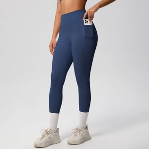 Detail of high waisted yoga leggings featuring a functional side pocket for a smartphone