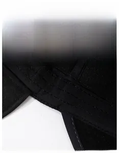 Detail of the wide sweatband inside the black winter cap with neat stitching