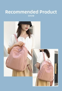 Pink waterproof nylon backpack with front zipper pocket and side compartments for daily use