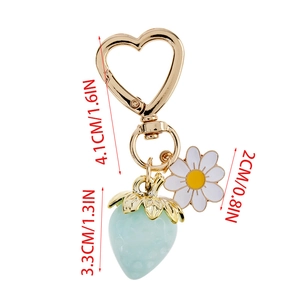 Detail showing dimensions of mint strawberry charm and daisy pendant on a gold heart clasp