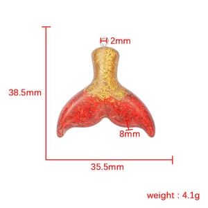 Resin mermaid tail pendant in gold red gradient with glitter and product dimensions