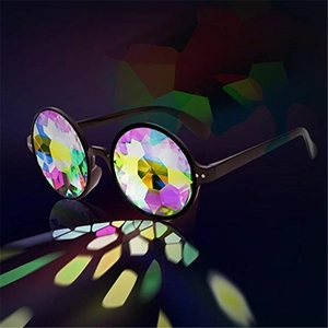 Detail of black round kaleidoscope glasses with multifaceted prism lenses and rainbow light
