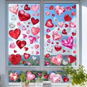 Valentine's heart window clings in red and pink with crystal texture on a glass pane