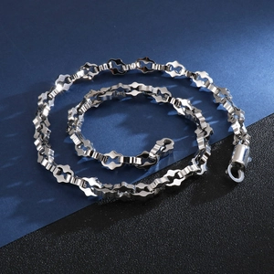 Detailed top view of a polished silver stainless steel geometric link chain necklace