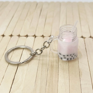 Creative bubble tea keychain featuring a pink strawberry drink model with pearls