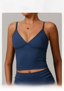 Detail of navy blue slim fit yoga vest featuring slim straps and a deep V-neckline