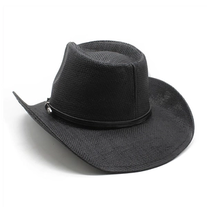 Detail of black straw fedora hat featuring a leather belt strap and silver metal buckle