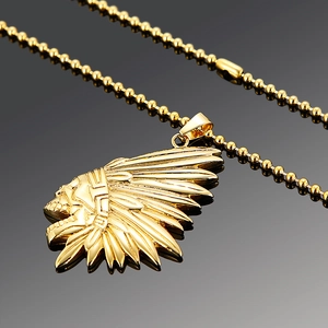 Gold stainless steel necklace with Indian skull feather pendant on black background