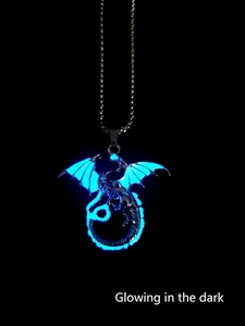 Luminous dragon pendant necklace in silver metal glowing bright blue in the dark