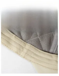 Detail of grey quilted lining and beige sweatband on a warm baseball cap interior