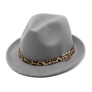 Detail of grey wool jazz hat featuring a leopard print band and golden buckle
