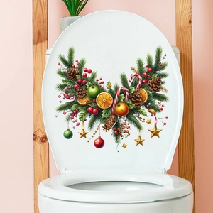 Detailed Christmas wreath wall sticker with pine cones and ornaments on a toilet lid