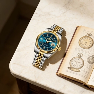Macro shot of two-tone men's watch with blue dial and fluted bezel on marble background