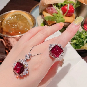 Red sugarloaf tourmaline jewelry set with halo diamonds on ring and necklace pendant