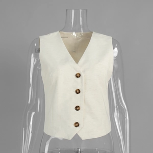 Close-up of off-white cotton linen vest showing V-neck and four brown buttons detail