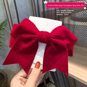 Detail of red velvet bow hair clip showing 15cm width and 5cm clip length for girls