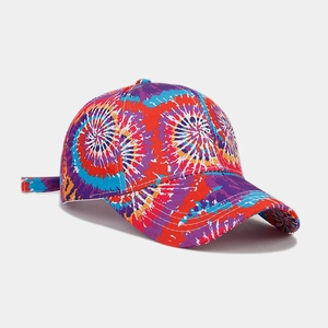 Detail of vibrant rainbow tie-dye baseball cap with curved brim and adjustable strap