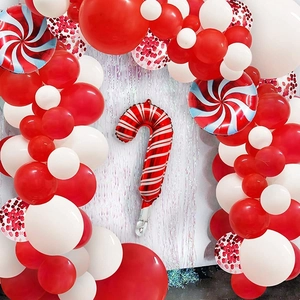 Detail of Christmas balloon arch with candy cane foils and red sequin latex balloons