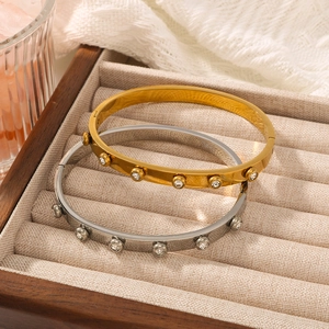 18K gold and silver plated stainless steel bangles with round zircon in a jewelry box