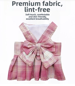 Detail of pink plaid pet harness dress with bow, breathable mesh lining and metal D-ring