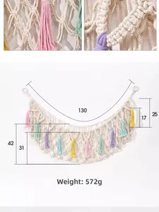 Detail view of woven cotton toy storage hammock with colorful tassels and dimension markings