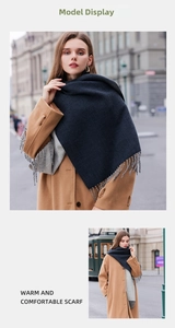 Close-up of double-sided solid color thick scarf with tassel detail and warm texture