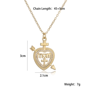 Detailed view of gold MOM heart pendant with cross and arrow design and crystal accents