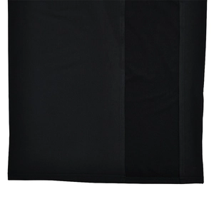 Detail view showing professional stitching and high-quality black fabric texture on the hemline
