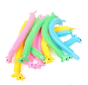 Close-up of colorful stretchy unicorn sensory fidget toys in pink, blue, and green