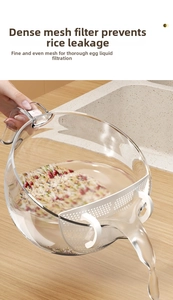 Close-up of white kitchen drain strainer with fine mesh filtering rice over a sink