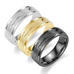 Three-piece titanium steel ring set with matte frosted finish in silver, gold, and black