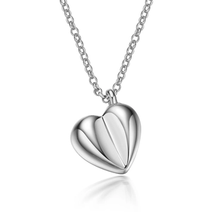 Macro shot of silver sterling heart pendant necklace with smooth mirror finish reflection