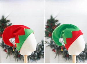 Detail of red and green felt elf hats with gold bells for Christmas party costumes