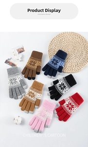 Close-up of winter knitted touchscreen gloves in multiple colors with snowflake pattern