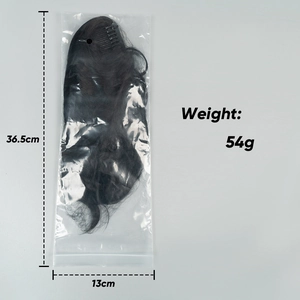 Postiche chignon taille 36,5x13cm poids 54g dans un sac d'emballage clair
