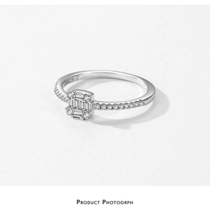 Detailed macro view of S925 sterling silver ring with square diamond and side accents