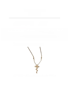 Detail view of gold vintage snake cross necklace with product dimensions and material specs