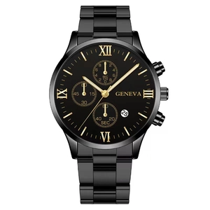 Detail view of black stainless steel quartz watch with gold roman numerals and calendar