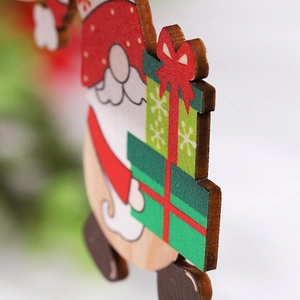 Detailed macro view of painted wooden Santa Claus ornament for Christmas tree decor