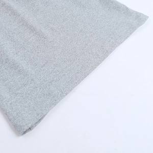 Detailed close-up showing the grey knitted fabric texture of the two-piece skirt set