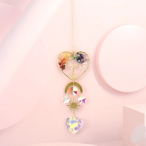 Detail of golden Tree of Life heart with colorful crystals and iridescent suncatcher pendant