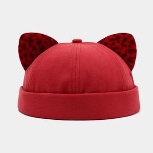 Detail showing red cotton docker hat with unique leopard print round animal ears