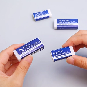 Minimalist 2B white plastic pencil eraser with blue sleeve held by hand for school use
