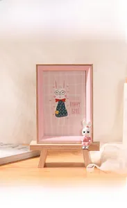 Close-up of a 4x6 wooden cartoon rabbit photo frame with pink bunny girl illustration