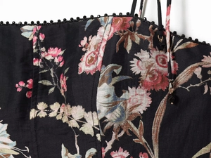 Detail of floral linen blend dress featuring beaded edge and delicate spaghetti straps