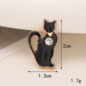 Detailed view of a black cat resin charm with rhinestone and 2cm by 1.3cm dimensions