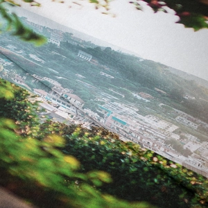 Macro view showing detailed fabric texture and mountain scenery print on tapestry